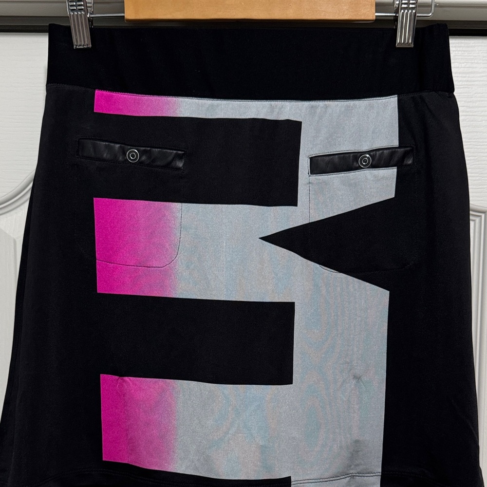 Jamie Sadock Black, Pink and silver golf skort.